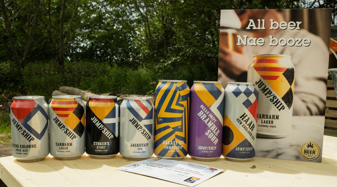 A selection of Jump Ship non-alcoholic beers on a bar in an outdoor setting front view