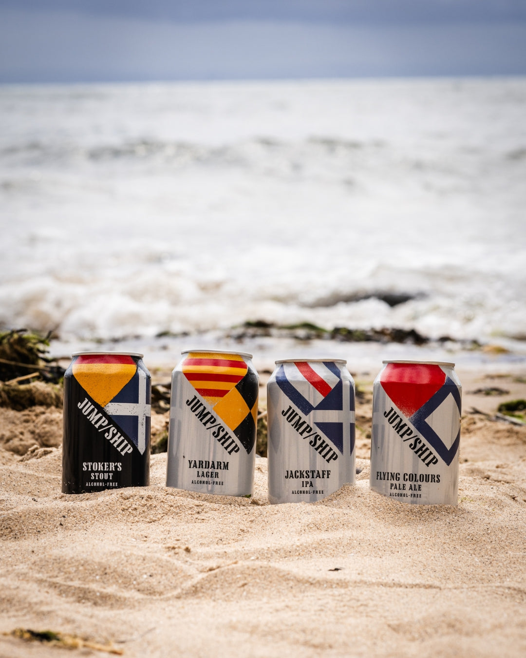 Four core range cans from Jump Ship on a beach