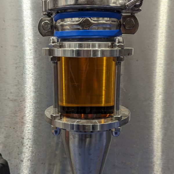 Close up of Yardarm alcohol-free lager as it passes to the canning line