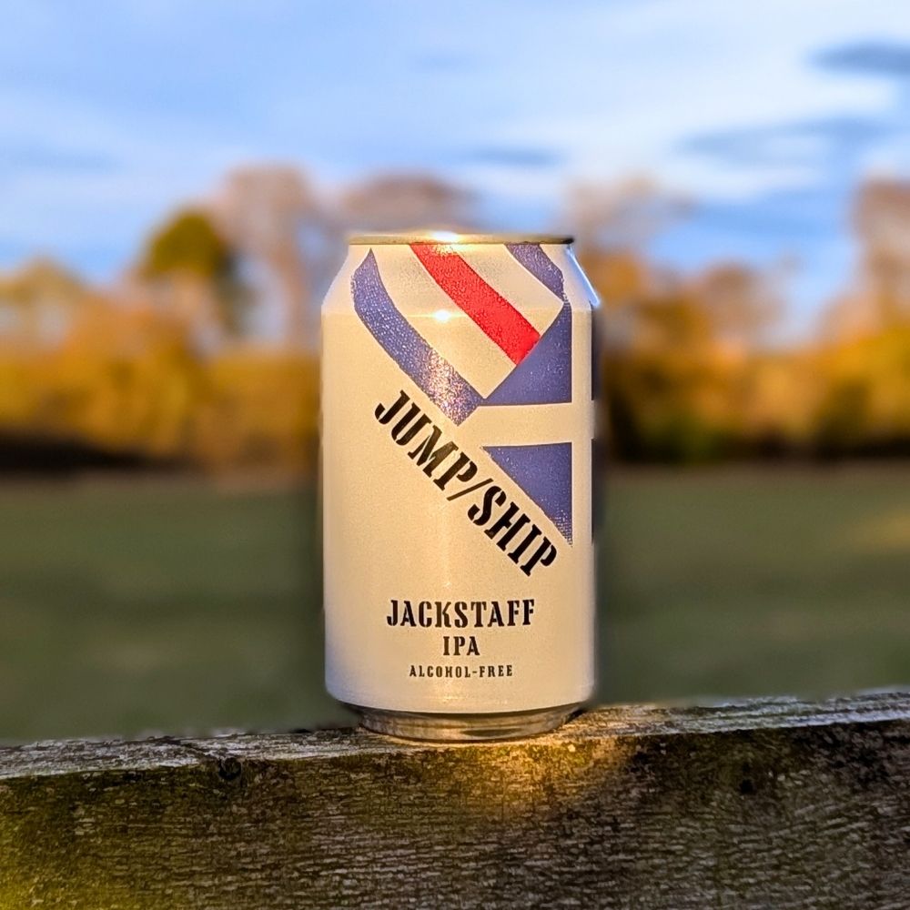 Can of Jackstaff IPA on a wooden surface with a blurred natural background