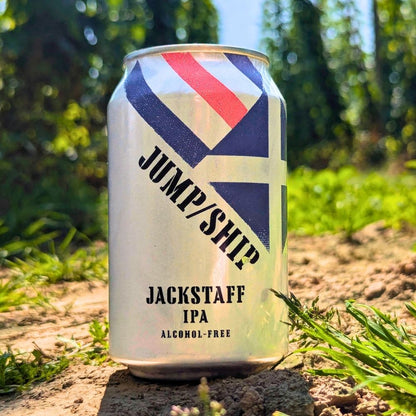 Can of Jackstaff IPA with 'Jump/Ship' branding in a field of hops